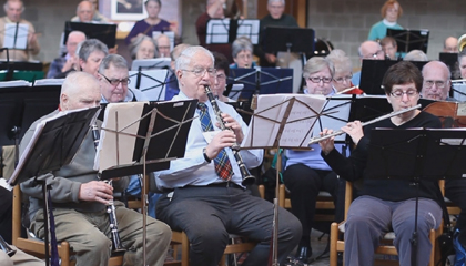 Senior musicians performing.